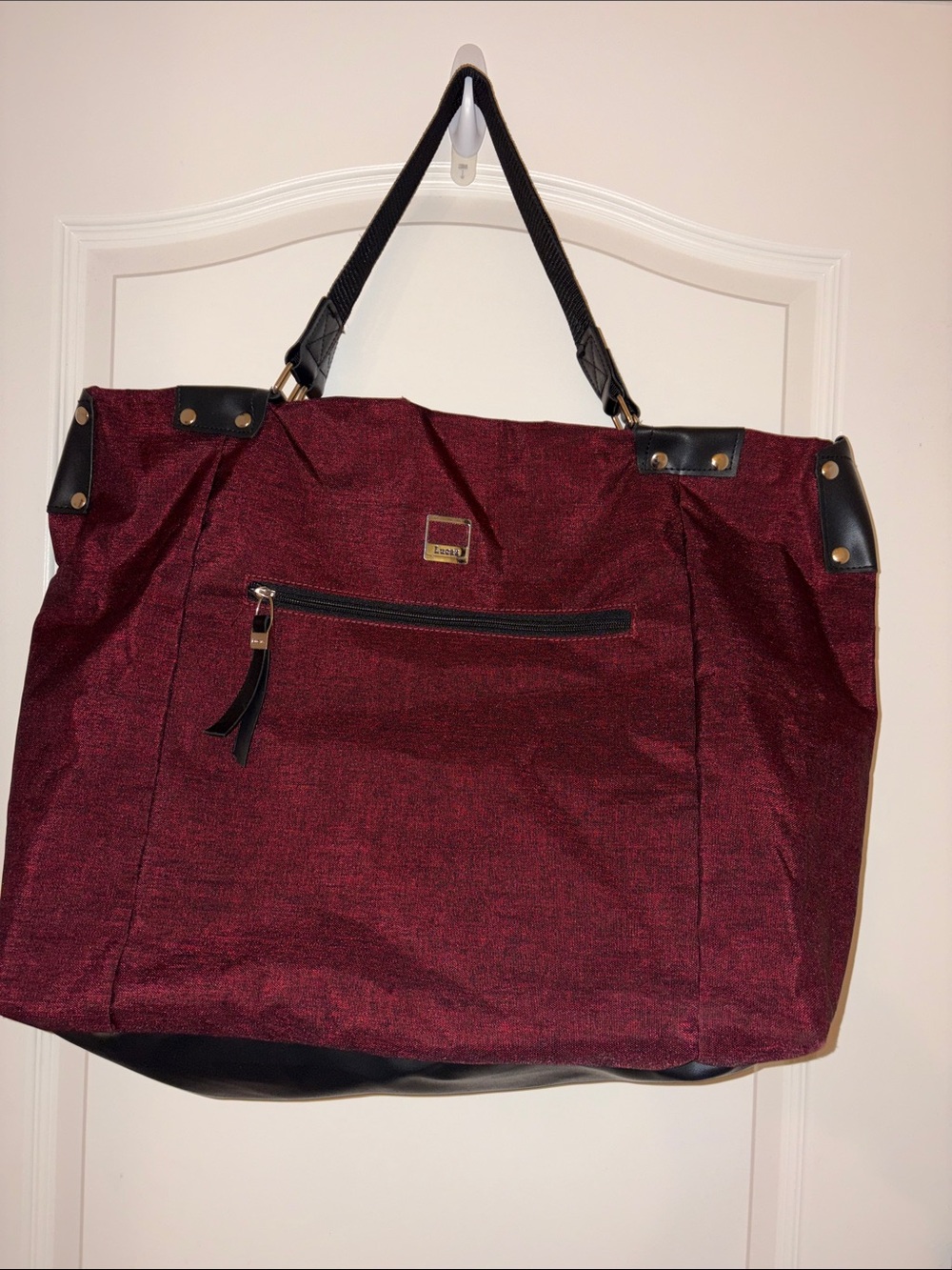 Large Burgundy Travel Bag with Black Trim 18 1/2 x 22 1/2. Lots of pockets